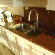 Some people choose to have splash-backs behind the cooker